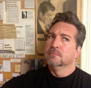 Standing next to The Door in our newsroom, which is the only thing here older than me... wait, is Ronald Reagan smelling my hair? 