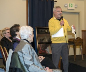 Siuslaw News publisher, John Bartlett, who uses the opportunity as emcee to confront me about my toilet paper consumption.