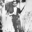 Lee Harvey Oswald with his rifle and two tickets to that weekend's Cowboys game
