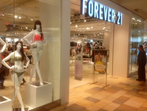 See the guy on the far right? The way he's staring, maybe the store should be named "Forever a Felony."